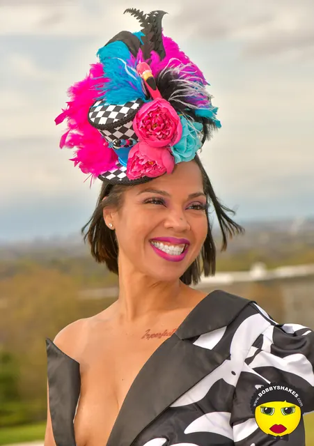 Guest in a feathered pink and turquoise headpiece at the 2026 Kentucky Derby Day Party in Boston